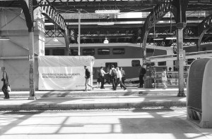 Pedestrians waiting beside construction signage at Union Station