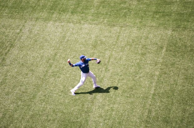 Jose Bautista throwing the ball between innings.
