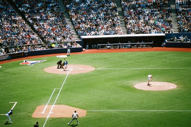 Jesse Chavez pitches a 90+ MPH heater to Ben Revere.