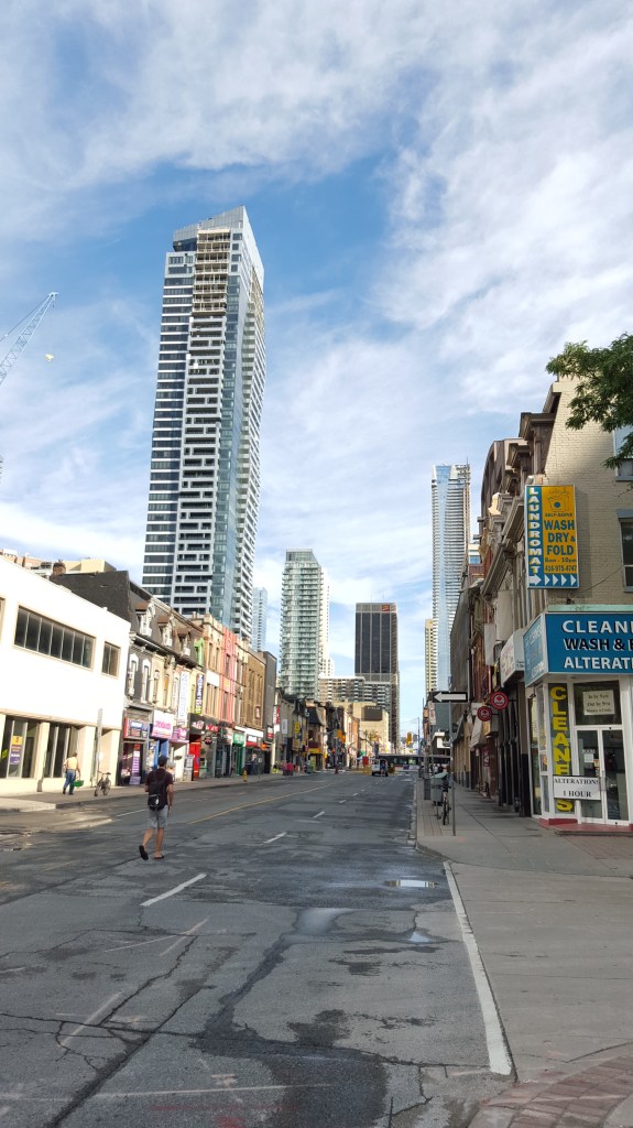 A quiet Yonge Street at 9:00, looking north from Maitland Street.